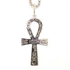 18K White Gold Ankh Diamond Pendant Specifications: Main Stone: 118 Round Diamonds, TW 5.30 carat H/SI1Weight: 23.2g Price: $10,995 - CALL US TO ORDER 504-908-0011 CHAIN NOT INCLUDED Diamonds are the birthstone for April and symbolizes innocence and constancy along with eternity and love. For that absolutely dazzling effect, purchase one of our stunning diamond pieces and let yourself shine on the outside as you do on the inside. Diamonds are the only thing that last a lifetime and can represent Diamond Ankh Necklace, Luxury Symbolic Ankh Necklaces, Luxury Gold Ankh Necklace, Silver Ankh Amulet Necklace, Spiritual Ankh Necklace Collectible, Diamond Pendant, Round Diamonds, White Gold, Chain