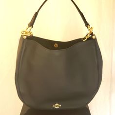 Nwt 100% Black Leather With Gold Accents Interior Is Black With 3 Pockets Length - 11 In Width - 13 In Side - 3 In Bottom - 3.5 In Handle - 17 In And Includes Adjustable Shoulder Strap. Elegant Coach Hobo Bag With Branded Hardware, Coach Evening Bags With Leather Lining, Elegant Coach Hobo Bag For Formal Occasions, Formal Coach Hobo Bag, Coach Black Hobo Bag For Formal Occasions, Coach Black Hobo Bag With Gold-tone Hardware, Designer Coach Hobo Bag For Formal Occasions, Designer Coach Hobo Bag For Formal Events, Designer Formal Coach Hobo Bag