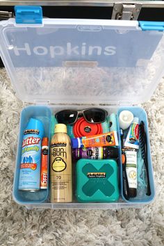 a plastic container filled with lots of different types of personal care products and hygiene items