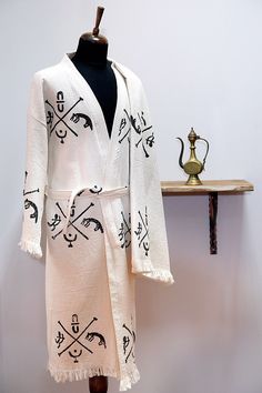 Purpose of usage; Turkish cotton robe, spa bath, boho robe, Made of %100 Cotton, Ethnic Kaftan, Kimono Robe, Dressing gown, Boho Cover Up, Meditation Robe, Organic Cotton bathrobe, lithograph pattern, Unisex Spa robe Dries very quickly, soft and light, Eco friendly, absorbs water better than towel. Standart size Care: -You can wash in cool water 30C to 40C. Please do not use bleach or fabric softener. - Dry naturally. Don't machine dry! - Colors on your monitor may differ slightly from the origi White Bohemian Cotton Robe, Bohemian Long Sleeve Thobe As Beach Cover-up, Bohemian Long Abaya For Beach Cover-up, Cotton Kimono Sleeves Robe For Beach Cover-up, White Embroidered Kimono For Beach Cover-up, Cotton Bathrobe, Boho Robes, 4th Wedding Anniversary, Dressing Gown