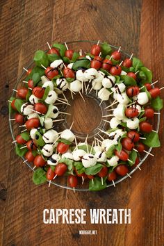 caprese wreath with tomatoes, mozzarella and spinach on skewers