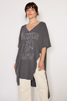 Lighten up your style with this Led Zeppelin 1977 Tunic Top! This rockin' look features a hi low hemline and oversized fit with a wide hemline, made from 100% organic cotton. Whether you're jammin' out or headed out, you know you'll be looking your best! Color: Charcoal Fabric: 100% Organic Cotton Ethically Made in Los Angeles Model wears a small Tumble dry on low Oversized Cotton Tops With Asymmetrical Hem, Oversized Cotton Top With Asymmetrical Hem, Oversized Edgy Tops For Spring, Trendy Summer Tops With High-low Hem, Trendy High-low Hem Tops For Summer, Edgy Cotton Tops With Frayed Hem, Edgy Cotton Top With Frayed Hem, Vintage Cotton Tops With Frayed Hem, Oversized Washed Edgy Tops