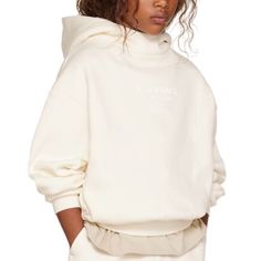 Brand New With Tags Essentials Fear Of God Kid’s Hoodie. The Kids Essentials Hoodie Provides Volume In The Body And Sleeves With The Intent Of Creating A Soft, Round, Cropped Silhouette. A Mock Neckline And Side Seam Pockets To Provide Functionality. The Fear Of God Essentials Fear Of God Logo Is Sized Subtly At The Center Front In A Rubberized Soft-Touch Applique, And A Fear Of God Rubberized Label Is On The Hood. Unisex Fit. Sold Out Online. Color Is Cloud Dancer (An Ivory/Off White Color). Si White Oversized Turtleneck Sweatshirt, Oversized White Turtleneck Sweatshirt, White Funnel Neck Tops With Ribbed Cuffs, Trendy White Hoodie With Ribbed Cuffs, White Hooded Sweater For Spring, Sporty White Funnel Neck Top, White Hooded Spring Sweater, White Funnel Neck Sporty Top, White Sporty Funnel Neck Top