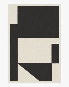 a black and white rug with an abstract design