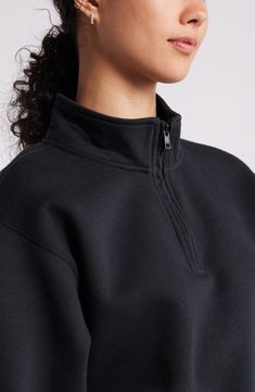 Dropped shoulders frame this quarter-zip sweatshirt that keeps you cozy and stylish at the same time. 18" length (size Medium) Quarter-zip closure Stand collar Ribbed cuffs and hem 68% cotton, 32% recycled polyester Machine wash, tumble dry Imported Not available for sale and shipment to Germany Winter Half-zip Sweatshirt With Ribbed Cuffs, Athleisure Half-zip Sweatshirt With Zipper Closure, Fall Half-zip Sweatshirt With Ribbed Collar, Fall Half-zip Sweats With Ribbed Cuffs, Half-zip Sweats With Ribbed Cuffs For Fall, Long Sleeve Fleece Sweatshirt With Zipper Closure, Fleece Sweatshirt With Zipper Closure And Long Sleeves, Winter Half-zip Sweatshirt With Ribbed Collar, Black Long Sleeve Sweatshirt With Ykk Zipper