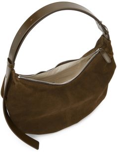 Suede shoulder bag in brown. Adjustable tonal buffed leather shoulder strap with pin-buckle fastening at top. Zip closure at main compartment. Zippered pocket and textile logo patch at interior. Canvas lining in beige. Silver-tone hardware. Approx. 14 length x 9 height x 4 width. Available exclusively at SSENSE. Supplier color: Caramel Nothing Written, Textile Logo, Canvas Shoulder Bag, Nylon Bag, Brown Suede, Luxury Streetwear, Rebecca Minkoff Hobo, Patch Logo, Zipper Pocket