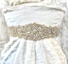 Crystal Sash, Wedding Sash, Crystal bridal sash, bridal sash, crystal rhinestone sash, wide sash, rhinestone sash belt, crystal belt -Absolutely stunning estate style rhinestone sash. Pictures don't do this gorgeous piece justice. Comes on your color choice satin tie back sash. Shown on a size 2 mannequin.- -Beading available in longer and shorter lengths, please browse my listings or contact me for other sizes.- --------IMPORTANT INFORMATION------ PLEASE READ MY MAIN PAGE BANNER AS WELL AS MY S Wedding Belts And Sashes, Crystal Wedding Dress, Wedding Dress Sash, Wedding Dress Belt, Crystal Belt, Wedding Sash Belt, Satin Sash, Dress Sash, Wedding Sash