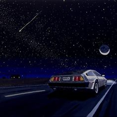 a car is driving down the road at night with stars in the sky above it