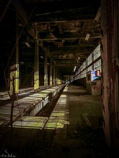 an abandoned train station with lots of windows