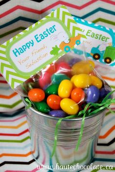 a bucket filled with colorful candies on top of a table