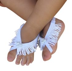 "Baptism Baby Sandals, White Sandals, White Barefoot Sandals, Barefoot Baby Sandals, Baby Barefoot Sandals, Baby Accessories These White Fringe Baby Barefoot Sandals are just perfect for any age! The front part of this sandal will not stretch but there is enough stretch elastic on the back for a perfect fit.  All my products are designed to make your baby look beautiful while feeling really comfortable. Perfect for photo shoots and to wear to a special occasion. My Baby Headbands and Baby Barefo White Barefoot Sandals, Barefoot Sandals Baby, Beach Wedding Sandals Barefoot, Beach Wedding Shoes, Baby Pearls, White Fringe, Baby Sewing Projects, Baby Sandals, Bow Sandals