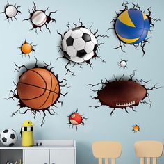 a room with several sports balls on the wall and one ball in the air through it