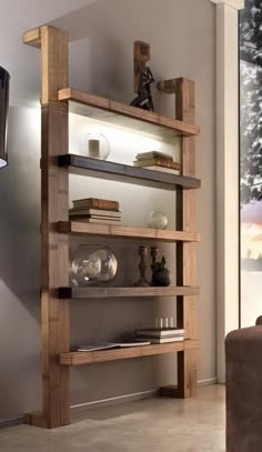 a living room filled with furniture and a flat screen tv on top of a wooden shelf