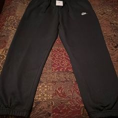 New! Mens Nike Sportswear Fleece Lined Elastic Ankle Sweatpant. Black Color Way. Mens Size Xl Waist 17.5 Inseam 30.25. Drawstring Waist And Two Hand Pockets. Pristine Condition. See All Photos Black Sports Sweats With Pockets, Comfortable Nike Streetwear Pants, Comfortable Nike Pants For Streetwear, Black Sweats With Pockets For Sports, Comfortable Streetwear Nike Pants, Comfortable Black Sweats With Pockets, Nike Winter Activewear With Elastic Waistband, Black Fleece Lounge Pants, Comfortable Black Fleece Sweatpants