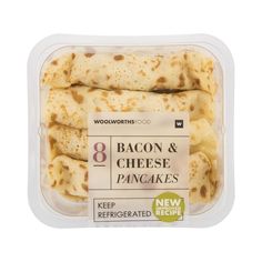 an image of bacon and cheese pancakes in a plastic container with label on the side