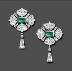 "Specification:- Stone Details :- *Diamond Material : Cubic Zirconia ( CZ ) *Center Diamond Shape : Emerald *Center Diamond Dimension : 10*7 MM (2 Pcs.) *Center Diamond Weight : 6.02 CT *Side Diamond Dimension : 1.10, 2.50, 4*2.5, 9*5, 8*5, MM *Diamond Color : White, Green *Diamond Clarity : VVS *Making Process: Handmade by our Experienced Staff. *Stamp: Our All Earring Stamped According to metal Purity (925 SIL). Custom Order:- *We do Accept Custom order. *Buyer can also request customization i Luxury Gemstone Diamond Earrings For Women, Pearl Earrings Designs, Wedding Earring, Jewellery Design Sketches, Wedding Earrings Drop, Stone Dangle Earrings, Jewellery Sketches, Back Drop, Green Diamond