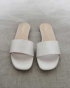 Classic slide flat sandals for casual and dressy look. Simple and easy wear for brides, bridesmaids and wedding parties.DETAILS:COLORS AVAILABLE: Ivory, Light Blue, White, Pink, and ChampagneUPPER: Synthetic upper and liningMATERIALS: Mandmade outsole STYLE NAME: EVELYN Bride Flat Sandals, Quinceanera Shoes, Bridesmaid Sandals, Shoes For Brides, Bridesmaids Shoes, Low Block Heel Sandal, Navy Blue Shoes, Pearl Sandals, Blue Wedding Shoes