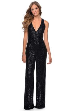 Set a style that would engage everyone in this enchanting evening look from La Femme 28719. This sequined design fashions a sleeveless, plunging halter V-neckline with a fitted bodice and a criss cross cut out open back. The bottom is tailored in a pair of loose leg pants. Be the embodiment of pure feminine flair in this mesmerizingly ornate La Femme style. Style: lafemme_28719 Details: Sequin, Sleeveless, Plunging V neckline, Halter, Criss Cross Back, Cut Out Back, Loose Leg Pants, Jumpsuit Len Jumpsuit For Prom, Prom Jumpsuit, Black Sequin Jumpsuit, Prom 2020, Sequin Jumpsuit, Prom Style, Prom Designs, Prom Girl, Prom Dresses With Sleeves