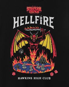 a black t - shirt with an image of a fire breathing bat on the front