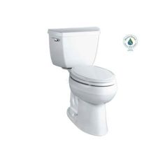 a white toilet sitting on top of a white floor next to a green sticker