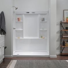 a white bath tub sitting inside of a bathroom