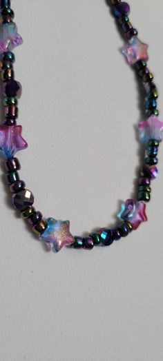 Shimmering Stars! Stars and shining faceted accent bead choker necklace. Adjustable, 14 to 16 inches. Multicolor, radiant and faceted glass beads catch the light and accent any outfit.  Great gift for all occasions! Thank you for checking out my product. Check my shop for more shiny things and have a great day! Star Charm Necklace For Festivals, Handmade Star Necklaces For Party, Trendy Star Shaped Beaded Jewelry, Adjustable Star Charm Necklace For Parties, Star Choker Necklace, Festival Beaded Star Necklaces, Trendy Star-shaped Beaded Necklace For Gift, Trendy Star-shaped Beaded Necklaces For Gifts, Trendy Star-shaped Beaded Jewelry