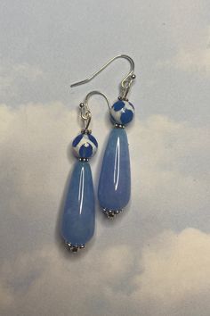 These earrings are inspired by the unique Tibetan Leopard Agate Beads. I love the unique blues and whites! The gorgeous sky blue teardrop bead is also agate.  Tibetan Agate enhances~ Strength  Courage  Cleansing Power  WEAR IN GOOD HEALTH! Blue Teardrop Earrings With Dangling Beads, Handmade Blue Agate Earrings, Blue Agate Earrings As A Gift, Hypoallergenic Blue Teardrop Pendant Earrings, Blue Drop Earrings With Natural Stones, Blue Teardrop Drop Earrings, Blue Beaded Drop Earrings, Blue Hypoallergenic Adjustable Teardrop Earrings, Blue Adjustable Hypoallergenic Teardrop Earrings