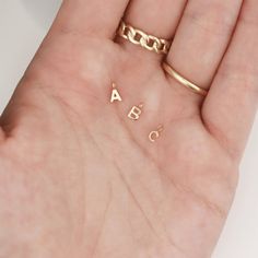 Our 14K Solid Gold Initial Letter Charms for permanent jewelry are the perfect addition to your permanent jewelry charm collection! These dainty solid gold charms are a great way to add more value and customization to your permanent jewelry business! #permanentjewelry #14kgold #14kgoldcharms #initialcharms #goldinitialcharms #lettercharms #bulkcharms #jewelrymaking #permanentjewelrybusiness #solidgoldcharms #permanentjewelryideas Permanent Jewelry Business, Gold Jewelry Making, Solid Gold Charms, Jewelry Chains, Permanent Jewelry, Charm Collection, Sterling Silver Initial, Jewelry Website, Girly Gifts