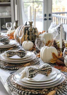 a dining room table set for thanksgiving dinner