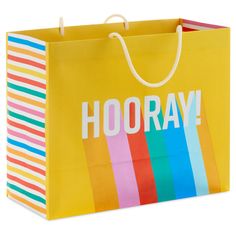 a yellow hooray bag with rainbow stripes on it