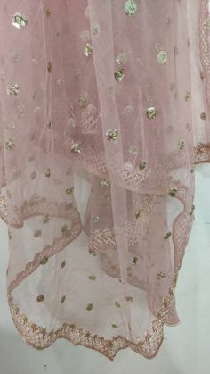 This is a Dupatta made on orders. It is made using dyeable net fabric with gold sequine embroidery all over. We make it colored as shown in the picture. Then we stitch a beautiful golden lace to all sides of it. Dupatta is having a length of 100 inches and width of around 40 inches. I don't keep it readymade I only make it exclusively for my customers. Can be fully customised. Reception Art Silk Anarkali Set With Sheer Dupatta, Diwali Sharara With Sheer Dupatta For Reception, Festival Anarkali Set With Sheer Dupatta For Reception, Festival Reception Anarkali Set With Sheer Dupatta, Festive Art Silk Sharara With Sheer Dupatta, Chanderi Saree With Dupatta For Reception, Floor-length Gota Work Dupatta For Eid, Festive Semi-stitched Tissue Silk Dupatta, Festive Tissue Silk Choli With Sheer Dupatta