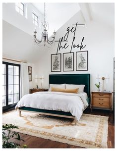 a bedroom with a bed, chandelier and pictures on the wall above it