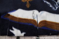 an image of the back of a sweater that has been cut into smaller pieces with scissors