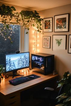 a desk with a computer, keyboard and monitor on it in front of a window