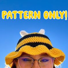 a woman wearing glasses and a knit bee hat with the words pattern only on it