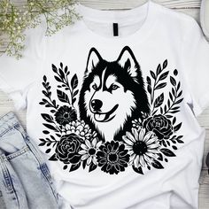 a t - shirt with an image of a husky dog surrounded by flowers and leaves