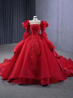 Prestigious Opulence! Step into the spotlight with this red prom dress that exudes regal sophistication. This gown is not merely a dress; it's a statement piece that speaks volumes of your grace and style. With its rich, vibrant red color, it embodies the very essence of celebration and grandeur. The bodice is a testament to artisanal excellence, featuring intricate floral appliques that cascade down the gown, creating a texture that's both visual and tactile. The off-shoulder sleeves add a touch of romantic allure, while the full skirt with its elegant train promises to glide across the dance floor with an almost royal command. With a minimum of 120 words, it's hard to capture the full splendor of this dress, which promises to make your prom night unforgettable. Silhouette:ball gownHemlin Chess Wedding, Red Dress Wedding, Red Princess Dress, Fairytale Wedding Gown, Shoulder Length Veil, Red Wedding Gowns, Red Rose Dress, Plus Size Evening Gown, Voluminous Skirt