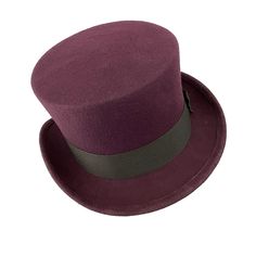 Low top hat for men and women. Plum Top Hat in the ad photo. You can make the hat with your favorite color by choosing it from my Wool felt color card. Made with short crown and embellished with a grosgrain ribbon. Edwardian top hat ideal for everyday and special ocasions such as weddings, cocktails or parties. For man and woman. Measurements in centimeters are 32 x 27. Crown height 11. Brim length 6. These measurements may have some slight variation depending on the size of the hat. The end of Classic Felt Top Hat For Winter, Fitted Felt Top Hat With Short Brim, Classic Fitted Felt Top Hat, Classic Fitted Top Hat In Felt, Elegant Adjustable Felt Top Hat, Formal High Crown Felt Hat For Winter, High Crown Fur Felt Hat For Winter, Winter High Crown Fur Felt Hat, Winter Top Hat With Flat Brim