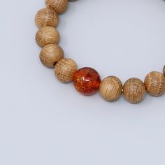 Japanese whiskey wood white oak wood bracelet bracelet Characteristics of the product Material : whiskey wood(oak wood) , Amber Wrist size : 17cm/15cm Main beads : about 11mm/8mm About whiskey wood A unisex bracelet that can be worn as a talisman to ward off evil or fulfill wishes.It is a simple bracelet that uses only whiskey wood, giving you a sense of the history of barrels that have grown whiskey for many years.The rubber is made of four layers of elastic and durable silicone rubber.This is Adjustable Natural Wood Bracelet, Traditional Wooden Beaded Bracelets For Meditation, Hand-strung Round Amber Bracelets, Amber Hand-strung Round Crystal Bracelet, Amber Hand-strung Bracelets For Meditation, Japanese Whisky, Amber Bracelet, White Oak Wood, Wood Bracelet