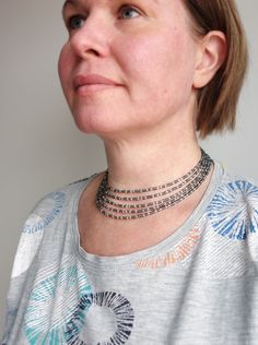 Layered Beaded Choker Necklace Grey Seed Beads Silver Beaded Choker Necklace With Spacer Beads, Bohemian Silver Beaded Choker Necklace, Silver Beaded Choker With Spacer Beads, Silver Spacer Beads Choker For Gift, Silver Beaded Choker Necklaces With Tiny Beads, Silver Choker With Tiny Beads, Adjustable Silver Choker With Spacer Beads, Silver Multi-strand Beaded Necklaces With Spacer Beads, Silver Multi-strand Beaded Necklace With Spacer Beads