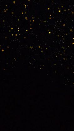 the sky is filled with yellow and black bubbles in it's dark, sprinkles