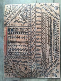 an old piece of cloth with designs on it