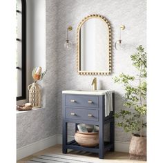 a bathroom with a sink, mirror and potted plant on the floor in front of it