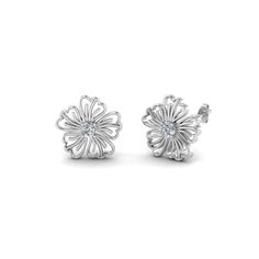 The Hibiscus Nature Inspired Earring For Women unfolds an aesthetic round shaped diamond with impeccable sparkle held in the center in a classic progn setting highlighted with an artistic hibiscus flower design created with perfection offering you an enthralling look. Round cut diamonds of 0.10 Total Carat Weight with Clarity SI2 and Color G studded in a prong setting.                                   &nbs Hibiscus Flower Design, Emerald Earrings Studs, Round Flower, Sapphire Solitaire, Fancy Earrings, Jewelry Simple, Earring For Women, Flower Stud, Hibiscus Flower