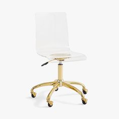 a clear office chair with gold wheels