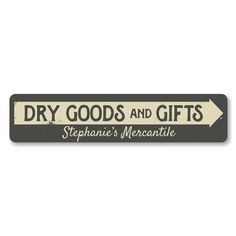 a sign that says dry goods and gifts with an arrow pointing to the left side