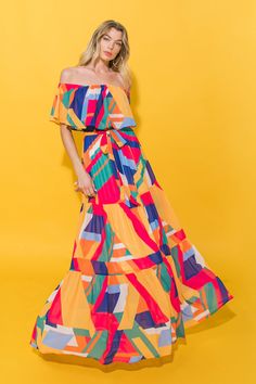 A printed woven maxi dress featuring off shoulder neckline, elasticized waist, self sash tie and tiered skirtDetailsSelf: 100% PolyesterLining: 100% PolyesterSize & Fit- Model is 5`8" And Wearing Size Small- Measurements Taken From Size Small- Approx. Length: 50.5" Multicolor Chiffon Dress With Flowy Skirt, Multicolor Chiffon Summer Dress, Chic Flowy Maxi Dress With Vibrant Print, Spring Off-shoulder Lined Maxi Dress, Vibrant Flowy Summer Dress, Casual Multicolor Chiffon Maxi Dress, Casual Multicolor Flowy Maxi Dress, Vibrant Flowy Dress For Day Out, Multicolor Chiffon Sundress