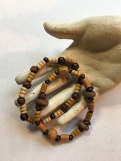 SALE! Get out your bellbottoms and and floppy hat, this 2 piece stretch bracelet set features warm brown and tan wooden beads. 7 1/2" to 8". A lovely gift or treat yourself! Comes with gift box. Earthy Brown Beaded Bracelets With Round Beads, Brown Wooden Bracelets With Round Beads, Brown Beaded Stretch Bracelet With Round Beads, Earthy Brown Beaded Bracelets With Large Beads, Earthy Brown Beaded Bracelets For Beach, Brown Wooden Beaded Bracelets With Round Beads, Handmade Adjustable Wooden Beaded Bracelets, Brown Wood Beaded Bracelets With Round Beads, Adjustable Brown Beaded Bracelets With Large Beads