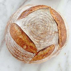 a loaf of bread sitting on top of a white counter