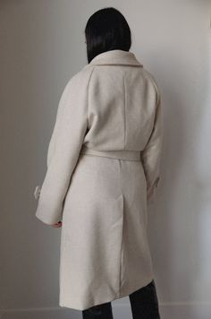 This belted wool blend coat is both stylish and luxe. Crafted from a wool blend in an oatmeal cream hue, it is fully lined for added warmth. Featuring an oversized collar, removable belt, and pockets, you'll stay cozy and chic in any weather. wrap style wide lapel collar buttoned tab on sleeve edge front welt pockets belted midi length lined hand wash self: 60% wool 40% polyester model is wearing a small Curvy Date Night Outfit, Air Clothes, Cream Coat, Oatmeal Cream, Valentines Day Dresses, Beige Coat, Oversized Collar, Mini Accessories, Thick Wool